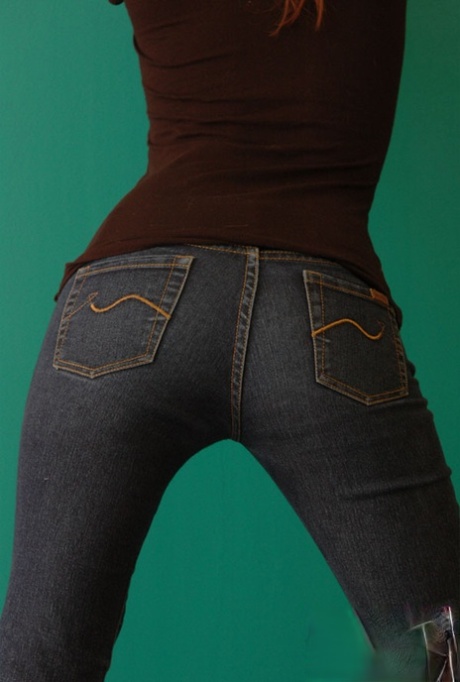 Natural redhead Korina Bliss covers her naked tits in a pair of denim jeans 78051760