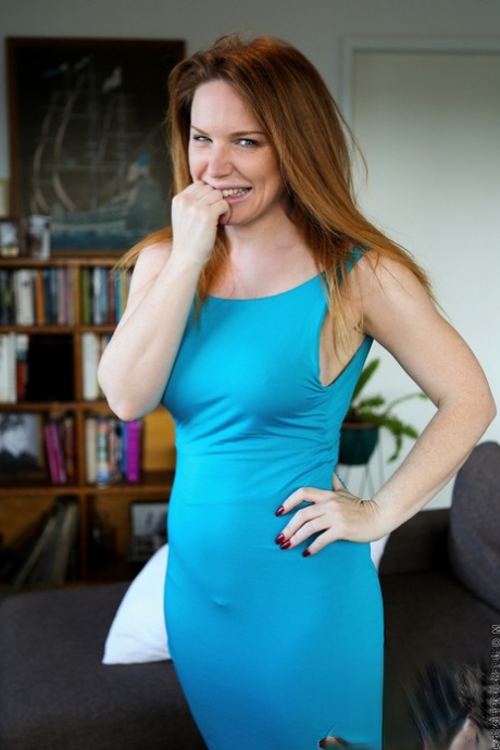 Redheaded amateur Madison Missina removes her dress and panties to masturbate 39574526