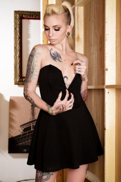 Tattooed fetish model Sierra Cure revealing tiny breasts and sexy legs 87429624